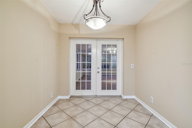 doorway to outside featuring french doors and light tile patterned floors