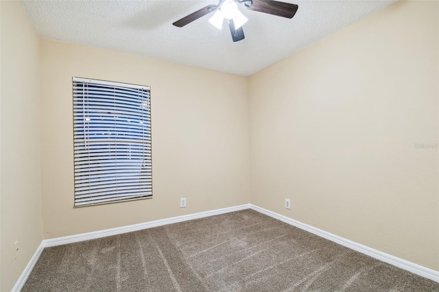 unfurnished room with carpet, ceiling fan, and a textured ceiling