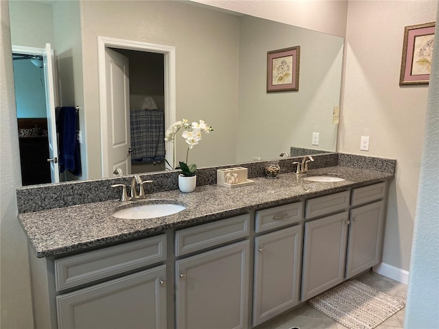 bathroom featuring tile patterned flooring and vanity