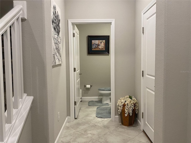 hallway with light tile patterned floors