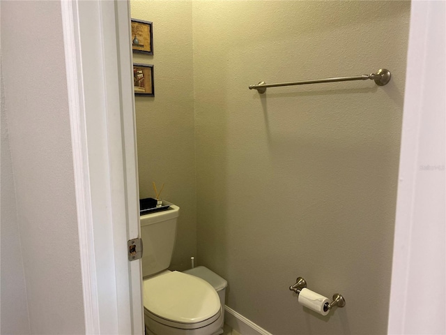 bathroom featuring toilet