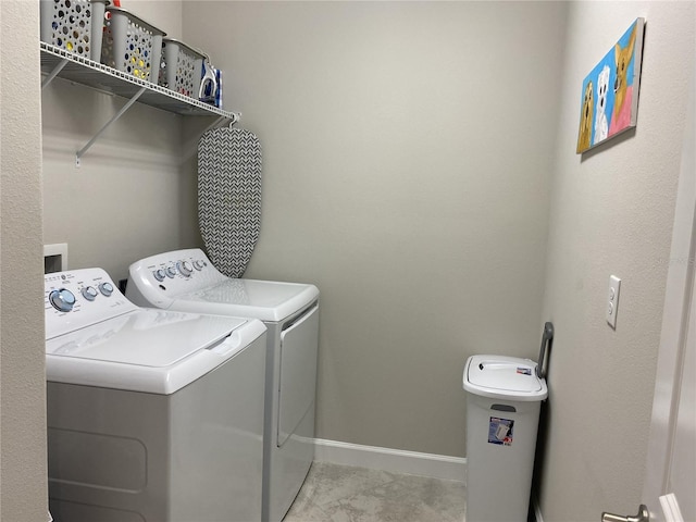 laundry area with separate washer and dryer