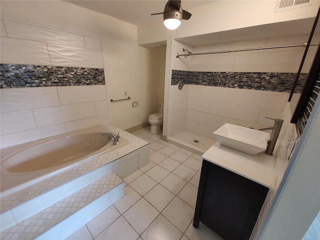 full bathroom with tile patterned floors, toilet, sink, and independent shower and bath