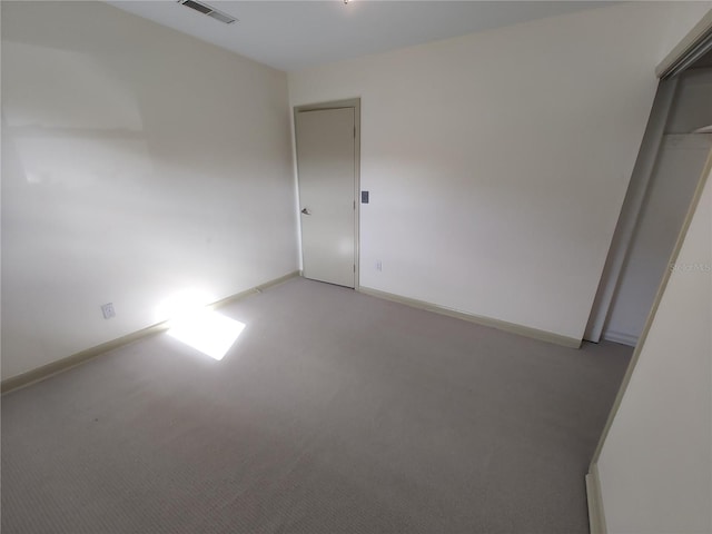 unfurnished bedroom featuring light colored carpet