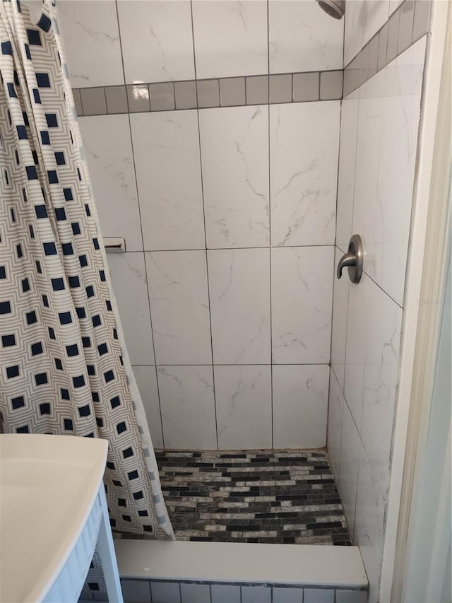 bathroom with a shower with shower curtain