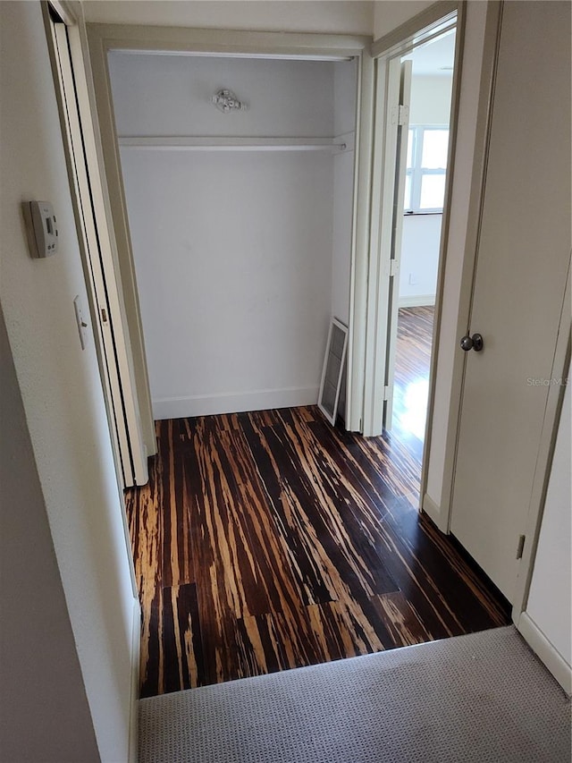 hallway featuring dark hardwood / wood-style floors