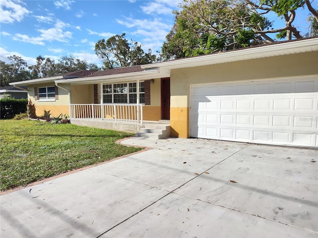 ranch-style home with a front yard, a garage, and covered porch