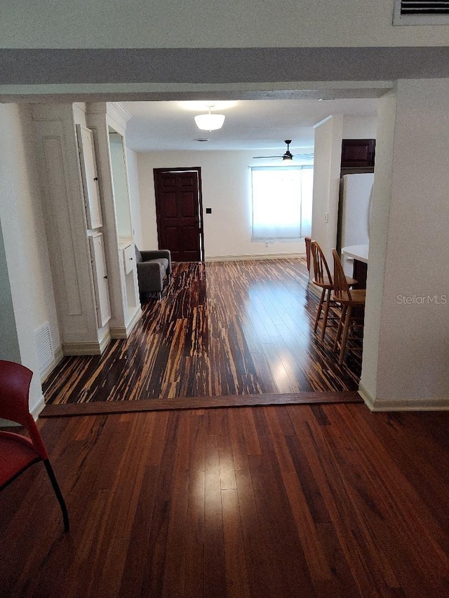 hallway with dark wood-type flooring