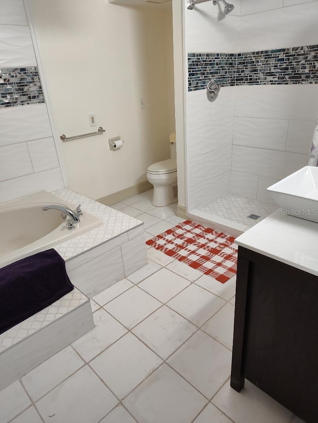 full bathroom with tile patterned flooring, vanity, separate shower and tub, and toilet