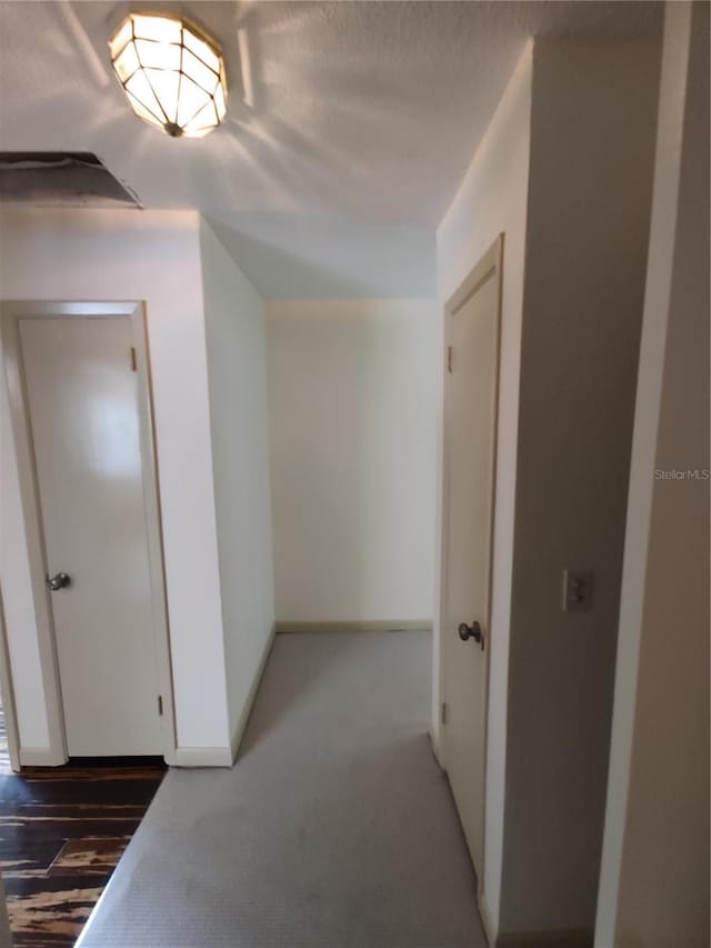 1182 Norwood Ave, Clearwater, FL 33756 - hallway with carpet floors and baseboards