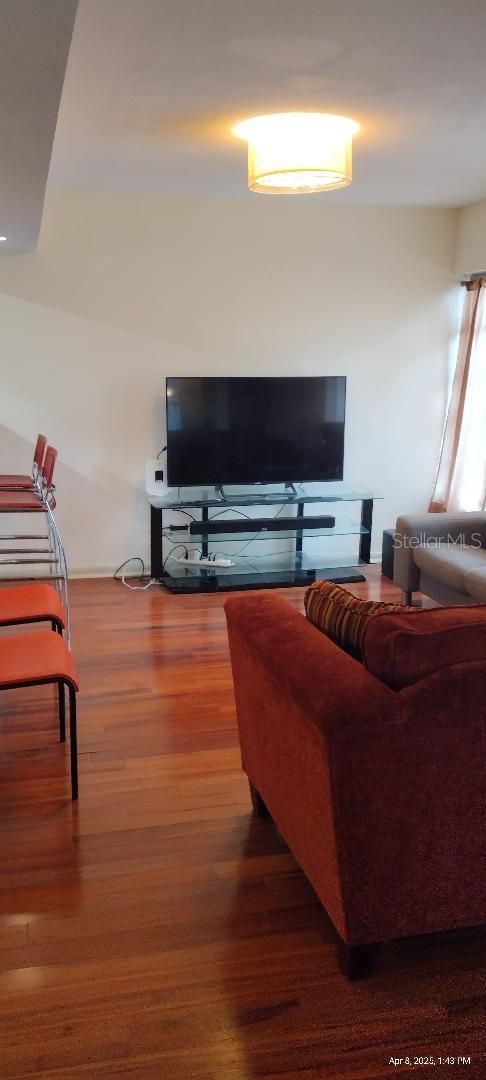 1182 Norwood Ave, Clearwater, FL 33756 - living area with wood finished floors