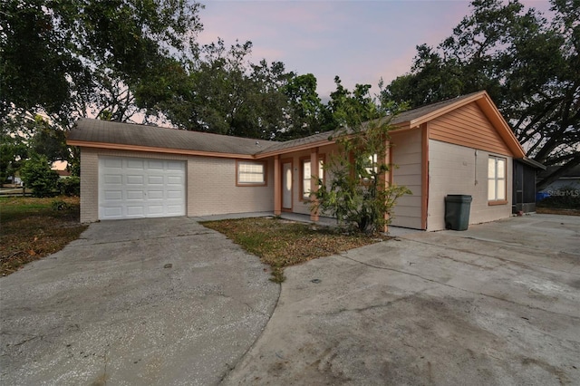 single story home with a garage