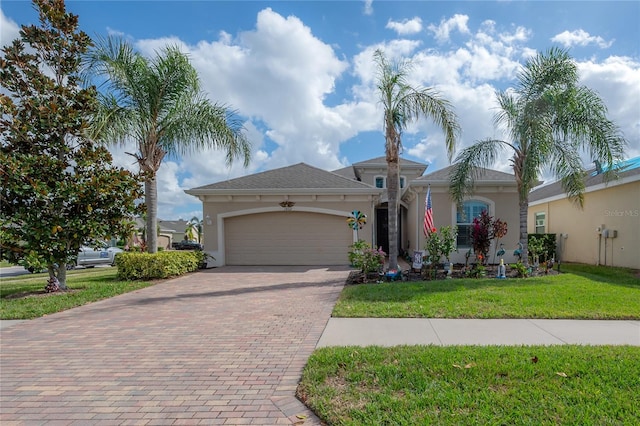 view of front facade featuring a garage and a front yard