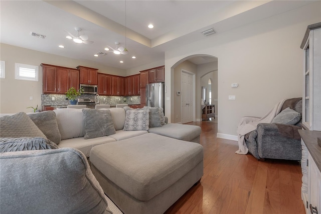 living room with dark hardwood / wood-style floors