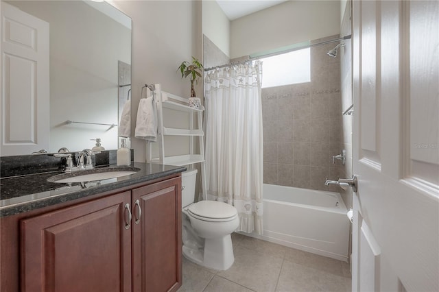 full bathroom featuring tile patterned floors, vanity, toilet, and shower / bath combo with shower curtain