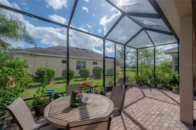 view of patio / terrace featuring glass enclosure