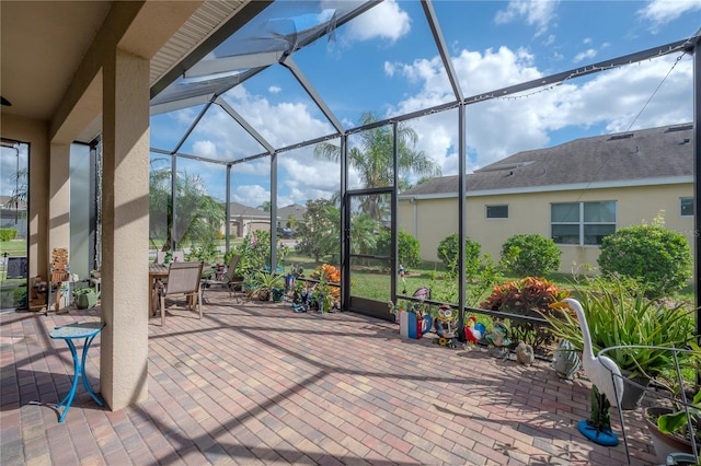 view of patio / terrace featuring a lanai