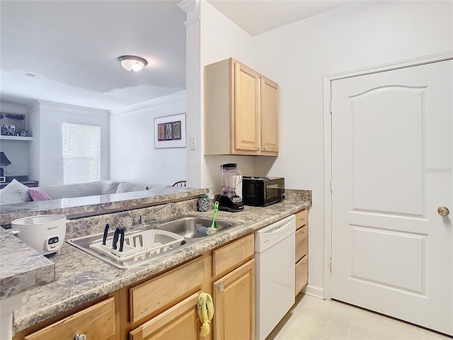 kitchen featuring dishwasher, sink, crown molding, and light brown cabinetry