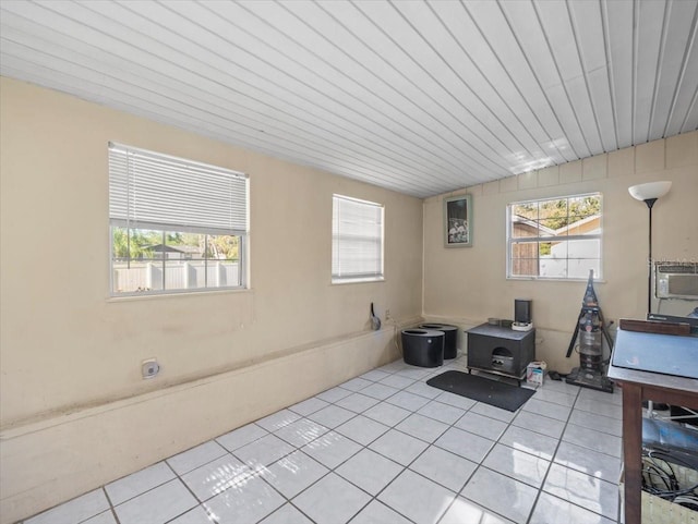 office featuring light tile patterned flooring and wooden ceiling