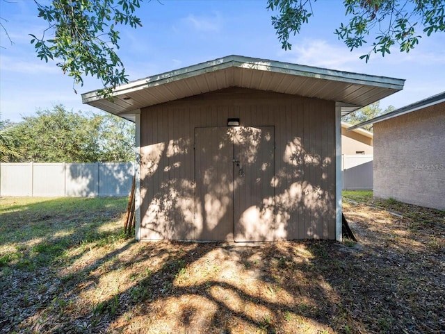 garage featuring a lawn