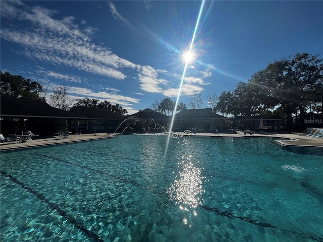 view of swimming pool featuring a patio area