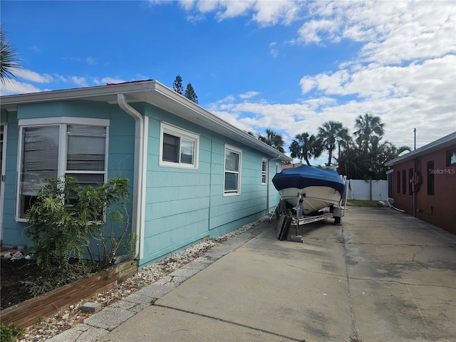 view of side of property with a patio area