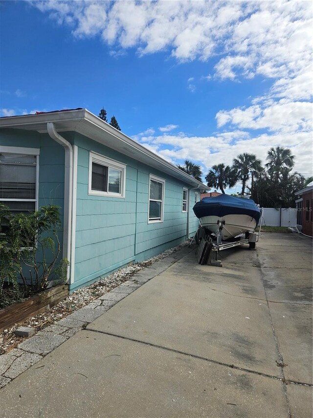 view of side of home with a patio area