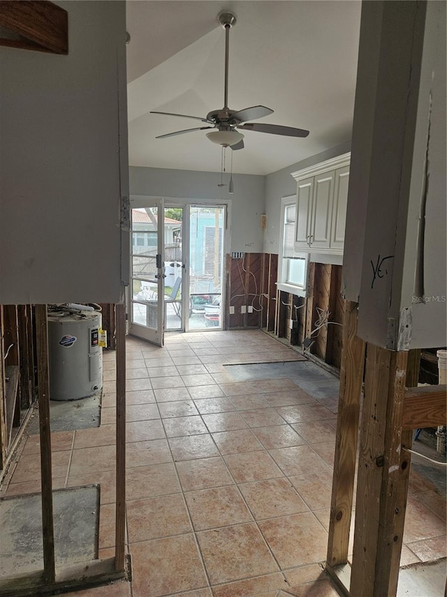 interior space with ceiling fan, french doors, and water heater