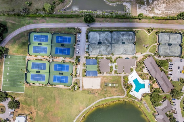 birds eye view of property with a water view