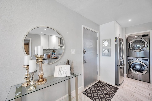 laundry room featuring stacked washer / dryer