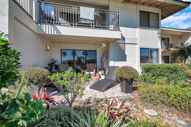 exterior space featuring a patio and a balcony