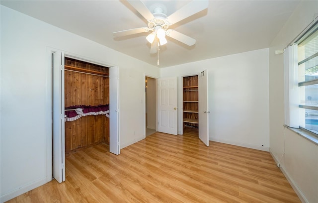 unfurnished bedroom featuring light hardwood / wood-style flooring, a closet, and ceiling fan