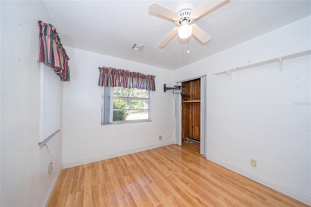 unfurnished bedroom featuring hardwood / wood-style flooring and ceiling fan