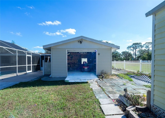 garage featuring a lawn