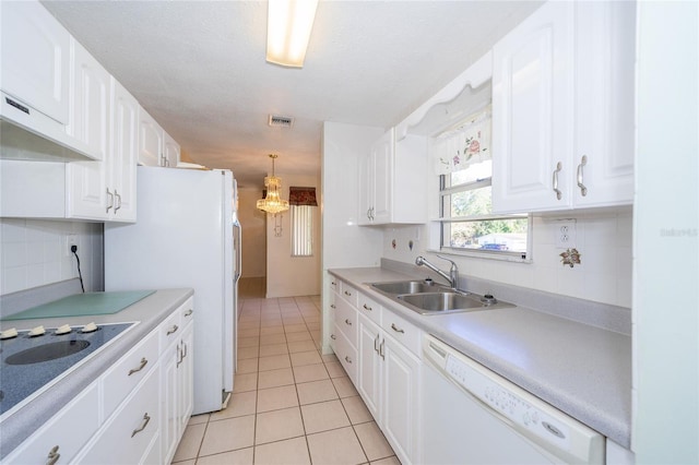 kitchen featuring white cabinets, white appliances, backsplash, and sink