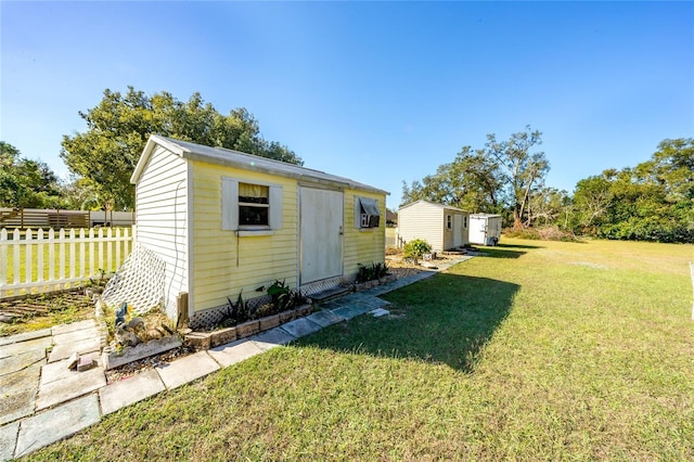 view of outbuilding featuring a yard