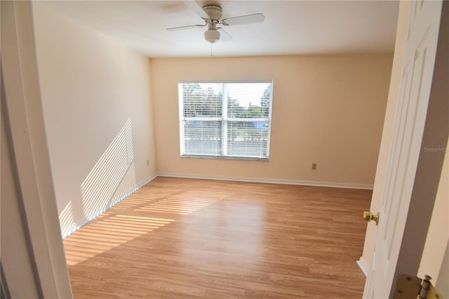 unfurnished room featuring ceiling fan and light wood-type flooring