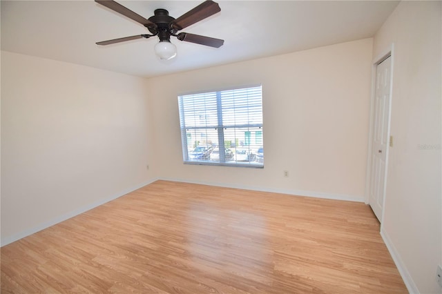 unfurnished room featuring ceiling fan and light hardwood / wood-style flooring