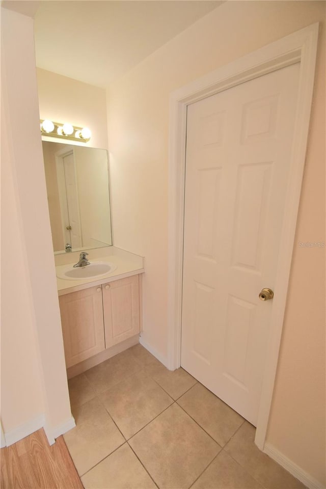 bathroom with tile patterned flooring and vanity