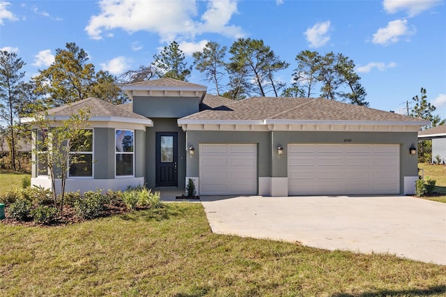 view of front of house featuring a garage and a front lawn