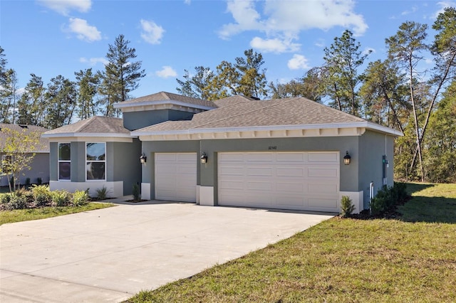 view of front of property featuring a garage and a front lawn