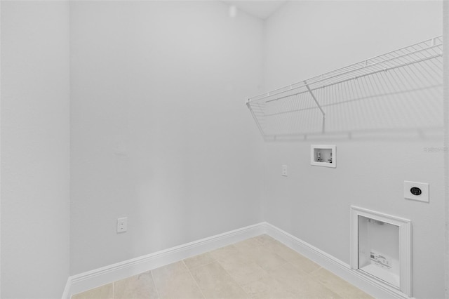 laundry area featuring washer hookup, electric dryer hookup, and tile patterned flooring