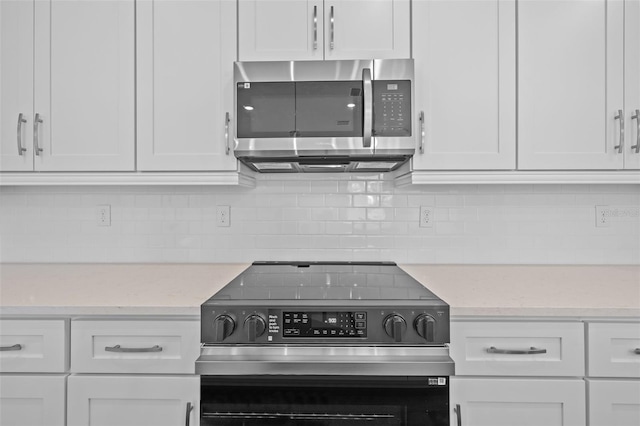 kitchen with white cabinets and stainless steel appliances