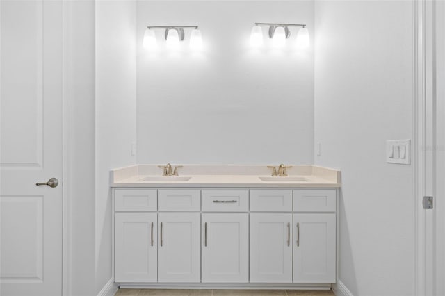 bathroom with tile patterned floors and vanity