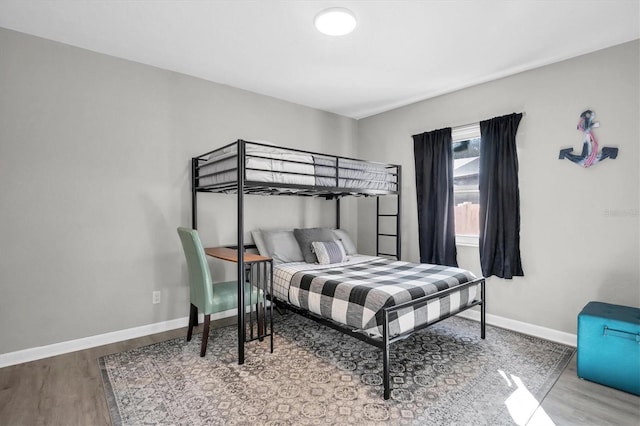 bedroom featuring wood-type flooring