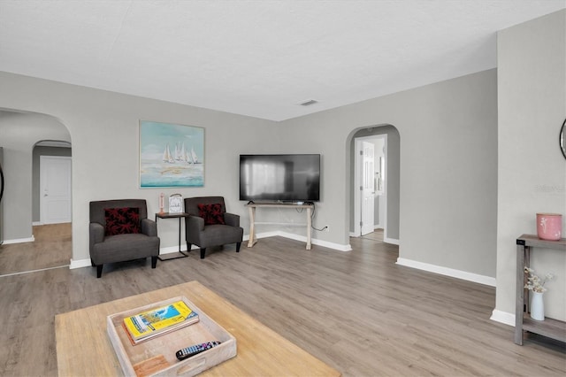 sitting room featuring hardwood / wood-style floors