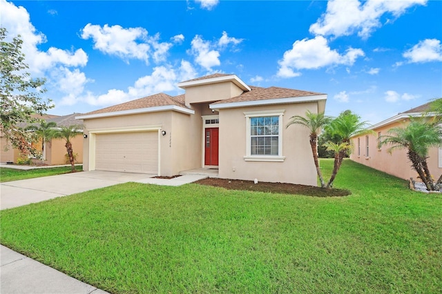 view of front facade featuring a front yard and a garage