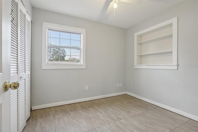 unfurnished bedroom featuring a closet and ceiling fan