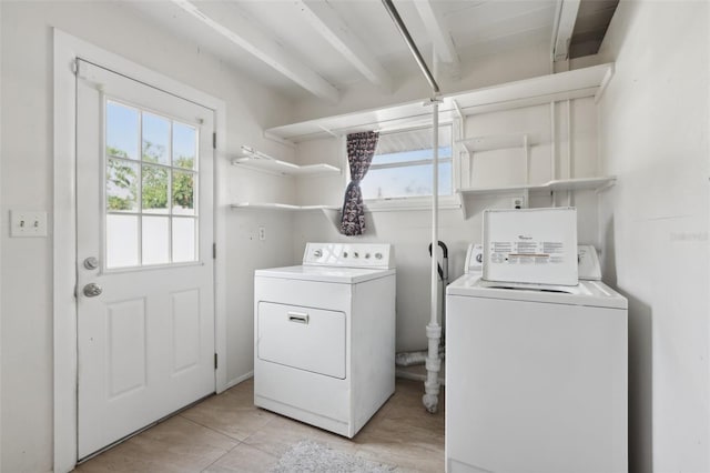 washroom featuring washer and dryer