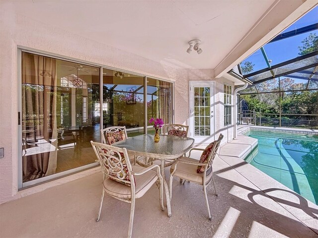 sunroom / solarium featuring a swimming pool